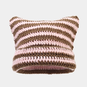 Detail of pink and brown striped handmade crochet cat ear knit hat with soft texture