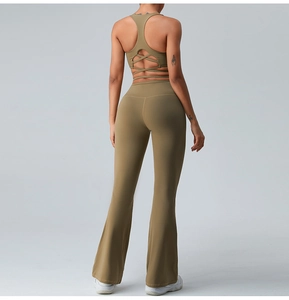 Rear view of olive green crossover sports bra and high-waisted flare yoga pants