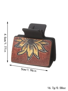 Pince à cheveux noire avec motif tournesol incluant dimensions et poids du produit