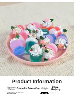 Macro view of pastel cream ice cream cup keychains with golden chains on a tray
