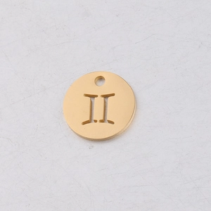 Detailed macro view of a 12mm gold mirror-finish pendant with Gemini Roman numeral II
