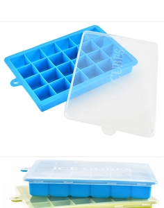 Blue 24-cavity silicone ice cube tray with transparent lid showing stacked colors