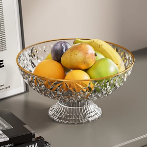 Detail of elegant footed fruit bowl with gold rim and crystal textured glass patterns