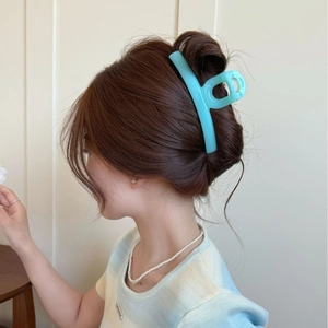 Elegant large teal blue butterfly hair claw clip shown on model for daily hairstyle
