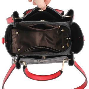 Contrast color leather tote bag with three compartments and gold hardware interior view