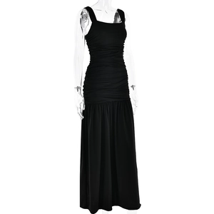 Detail of black square neck dress featuring ruched bodice and a ruffled mermaid hemline