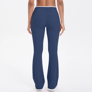 High-waisted navy blue flared yoga pants with white contrast trim shown from back view