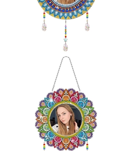 Detail of DIY mandala diamond art mirror with colorful crystals and hanging beads