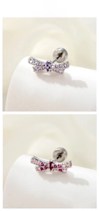 Detail of bow earrings featuring purple and pink zircons with screw back ball design