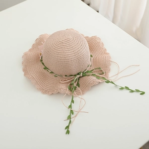 Pink straw sun hat for girls with scalloped edges and floral leaf ribbon decoration