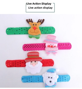 Detail shot of Christmas sequined slap bracelets with cute plush characters.