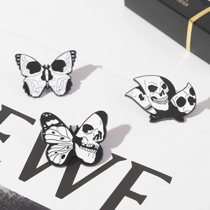 Three-piece punk skull butterfly enamel pins set in monochrome black and white