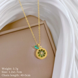 Detail of gold lemon pendant necklace with green crystals and size specifications