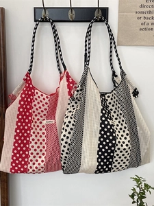 Polka dot and striped canvas tote bags in red and black colors with woven handles