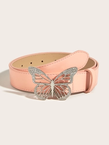 Macro detail of pink leather belt with butterfly buckle and sparkling rhinestones