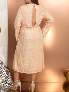 Elegant champagne gold sequin midi dress with long sleeves and sexy open back design