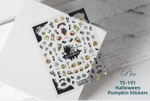 Detail of 5D Halloween nail stickers featuring pumpkins and ghosts on white stone