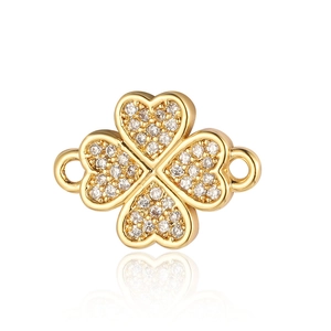 Close-up of golden four-leaf clover connector with micro-paved zircons for jewelry making