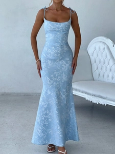 Detail of light blue floral fishtail dress showing lace-up straps and glossy fabric