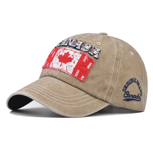 Close-up of vintage washed cotton baseball cap with Canada maple leaf embroidery detail