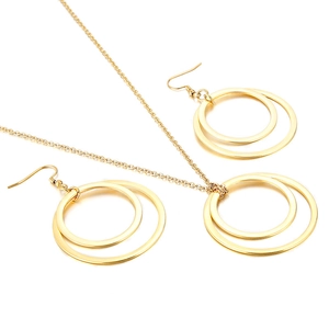 Golden geometric jewelry set with interlocking circle pendant necklace and stud earrings
