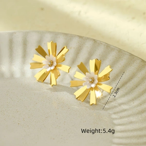 Detailed view of 2.3cm golden flower earrings with white petals and a rhinestone center