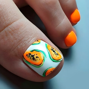 Detailed view of white toe nail tips featuring orange papaya art and solid orange polish
