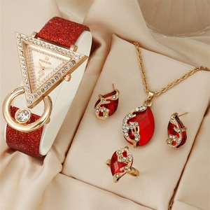 Luxury quartz watch set with triangle dial, red leather strap, and matching jewelry