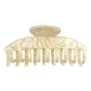 Detail of a beige marble patterned acetate hair claw clip with a classic curved tooth design