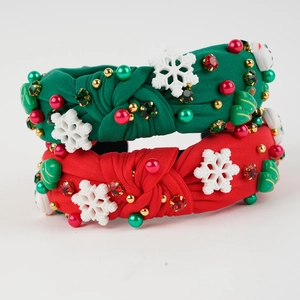 Detailed view of Christmas knotted headband featuring pearls, rhinestones and snowflakes