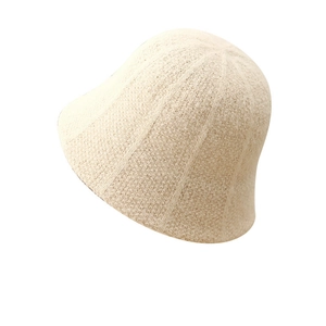 Minimalist beige knit bucket hat for women showing textured wool blend material