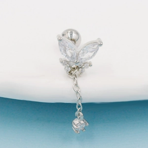 Macro view of butterfly cartilage earring with zircon stones and hanging chain detail
