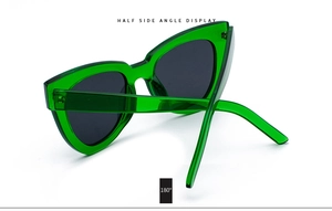 Detailed side profile of emerald green cat-eye sunglasses with 180 degree view angle