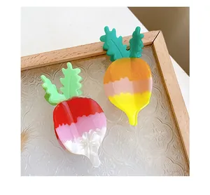 Close-up of rabbit-shaped acetate hair clips with vibrant gradient colors and glossy finish