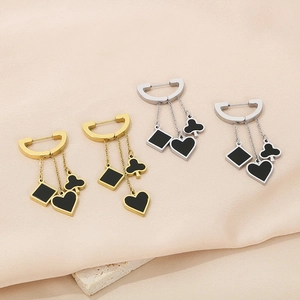 Elegant poker-themed gold and silver tassel earrings with heart and spade charms