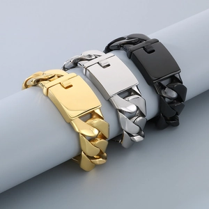Close-up of gold silver and black 24mm Cuban link bracelets for men on a display stand
