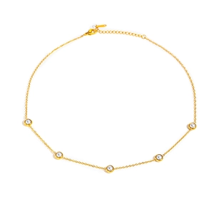Detailed shot of a gold bead titanium steel necklace featuring five elegant white pearls