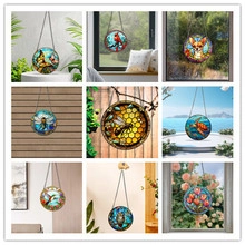 Detailed views of stained glass suncatchers with various bird and insect motifs