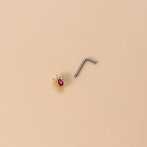L-shaped gold nose stud featuring a pear-shaped red zircon and sparkling clear accents