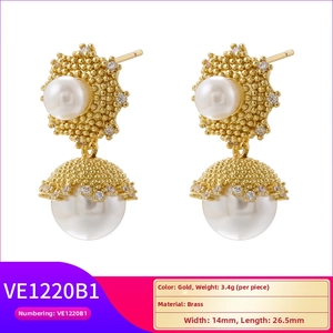Detail view of gold brass earrings with pearls and rhinestones measuring 14mm by 26.5mm