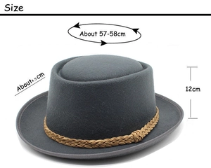 Detail view of dark grey wool pork pie hat showing size dimensions and braided band