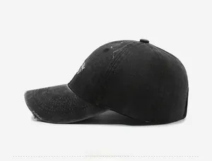 Side view of vintage washed charcoal baseball cap with distressed brim and embroidery