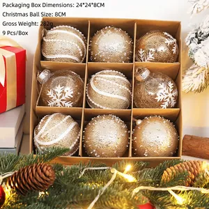 Set of 9 gold Christmas ornaments with snowflake and stripe details in a 24cm display box