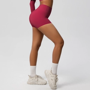 Close-up of seamless high-waisted yoga shorts in berry pink with butt-lifting fabric detail