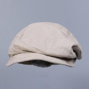 Close-up of breathable linen newsboy cap with refined cross-weave texture in light grey