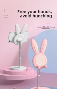 Detail of adjustable bunny phone stand showing non-slip pads and telescopic metal rod height