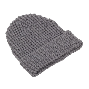 Detail of dark grey waffle knit winter hat showing thick ribbed cuff and textured weave