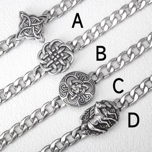 Detail view of four silver stainless steel Celtic knot and horse head bracelets