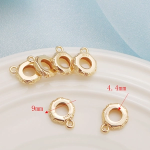 Detailed macro view of 9mm gold-plated S925 sterling silver beads with 4.4mm inner hole
