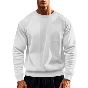 Detail of white crewneck sweatshirt with corduroy paneling and a functional chest pocket